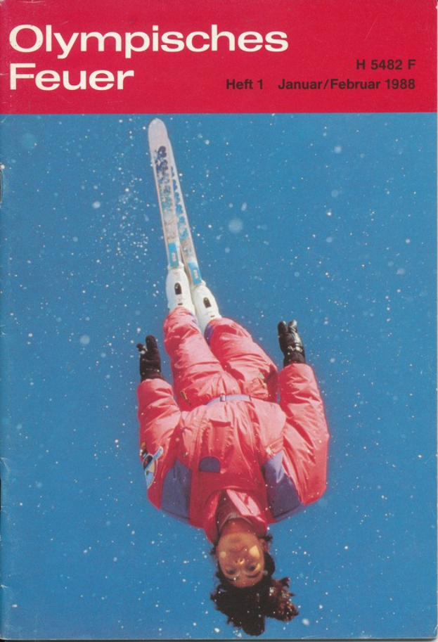 Ein Buchumschlag mit einem Skifahrer in der Luft, der einen Skianzug trägt, mit dem Text "Olympic Games Feuer - Heft 1 - Januar/Februar 1988."