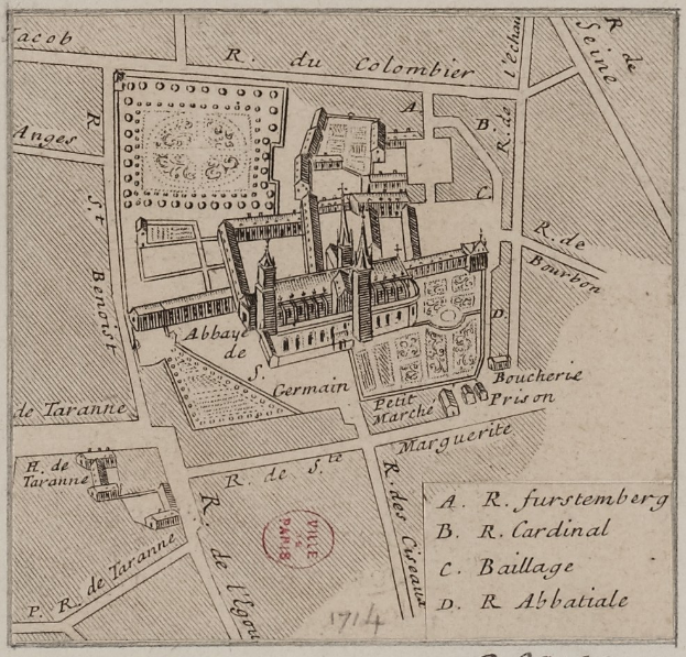 Ein altes Stadtplan mit einem zentralen Gebäude und beschreibendem Text auf dem Papier.