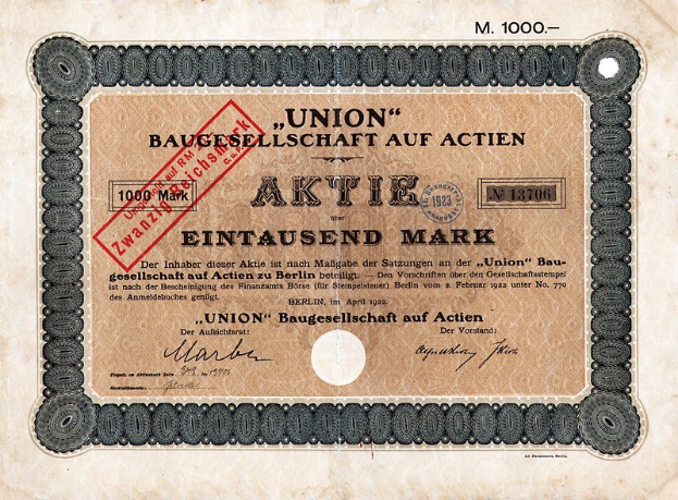 Alte deutsche Banknote mit rotem Stempel und Text, wahrscheinlich ein Aktienzertifikat.